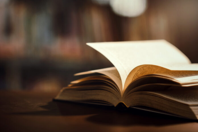Book in library with open textbook,education learning concept